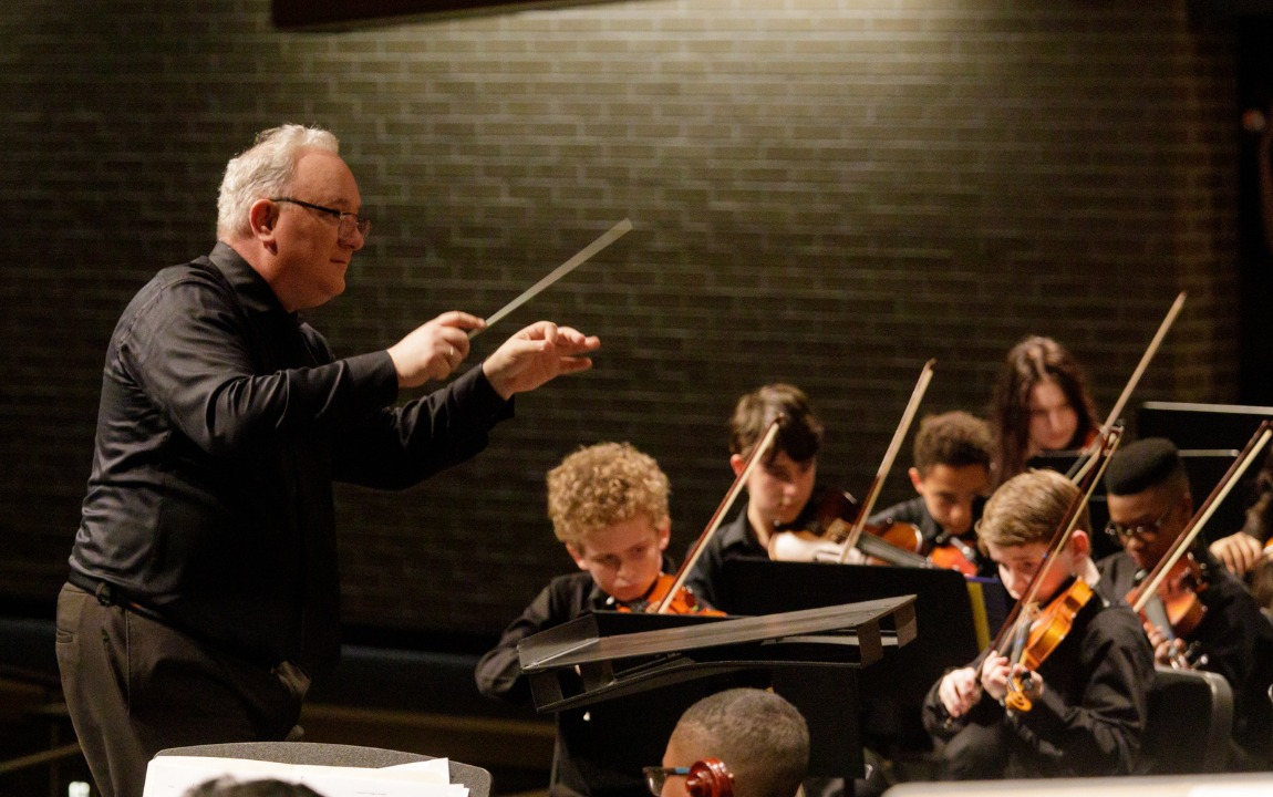 person conducting orchestra