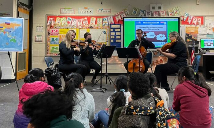 quartet performing in school classroom