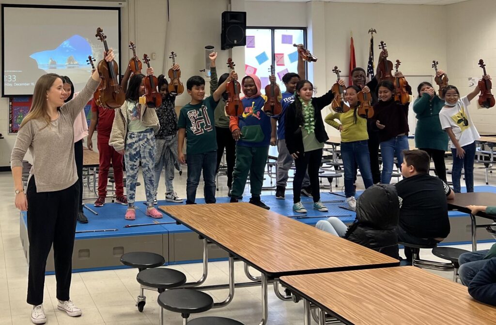 kids in classroom learning about the violin