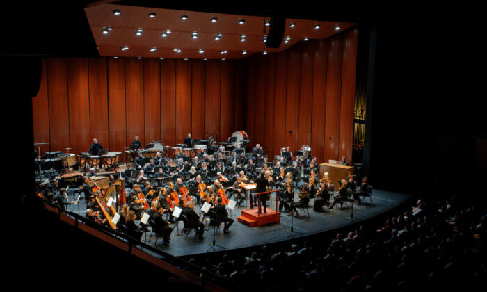 Orchestra on stage with house lights down