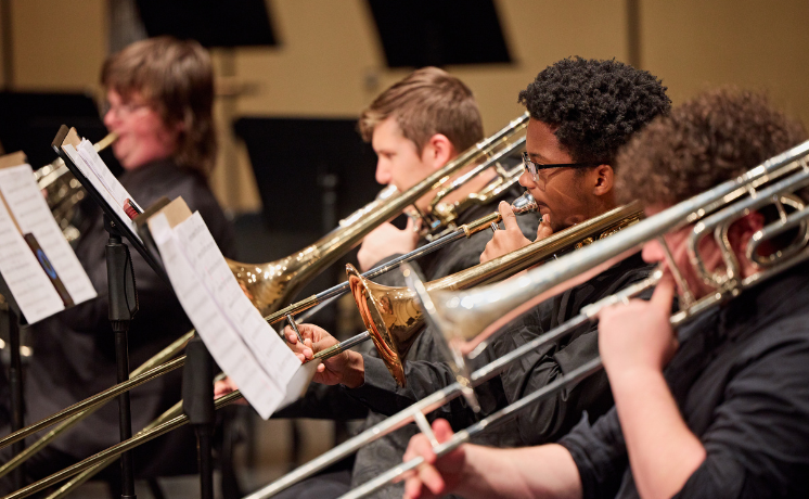 Academy Orchestra students performing in a concert